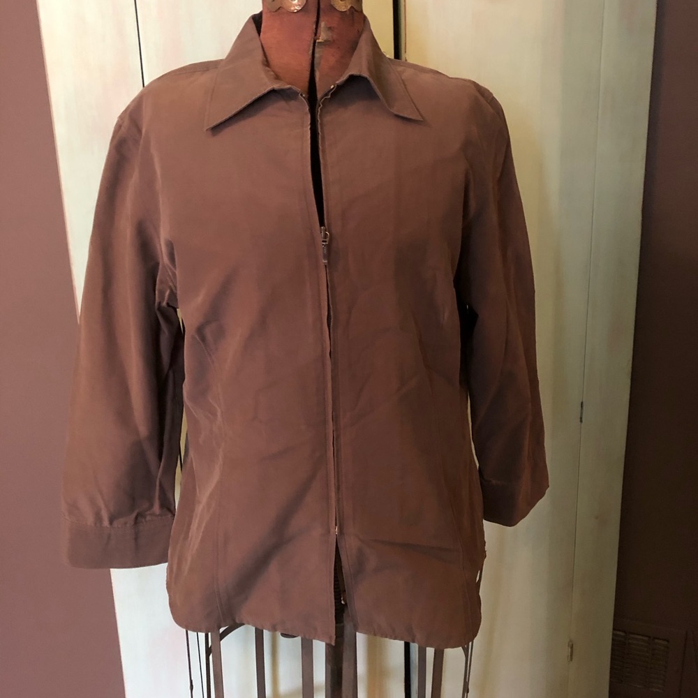 Brown blouse with a zipper front has 3/4  sleeves